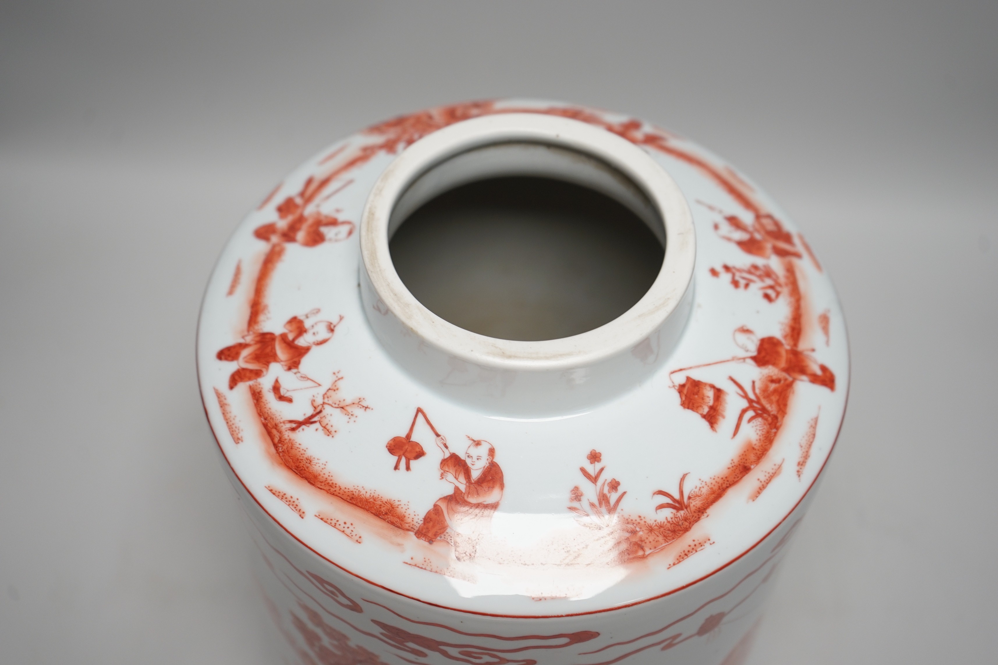 An early 20th century copper red enamelled canister. 30cm tall
